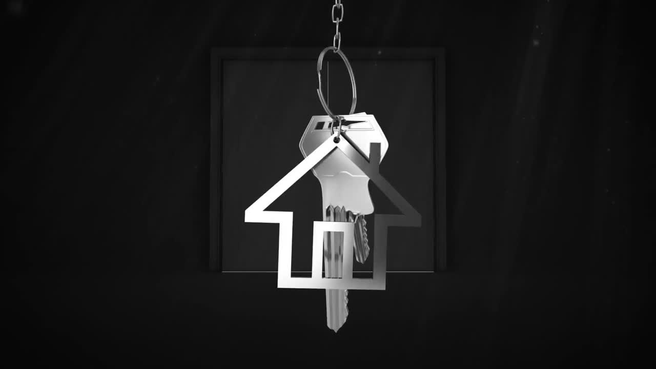 llaves de la casa y llaves colgando sobre la apertura de la puerta en el fondo