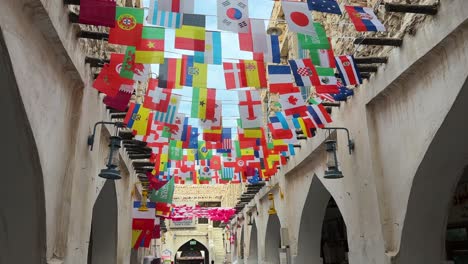 colorful country flag design in the old city of doha for the international fifa world cup football tournament to celebrate the ceremony of opening game in peace joyful scenic wonderful atmosphere