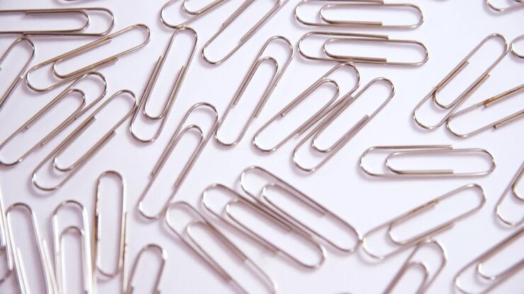 Paper clips on white background 4k