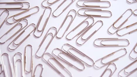 Paper-clips-on-white-background-4k