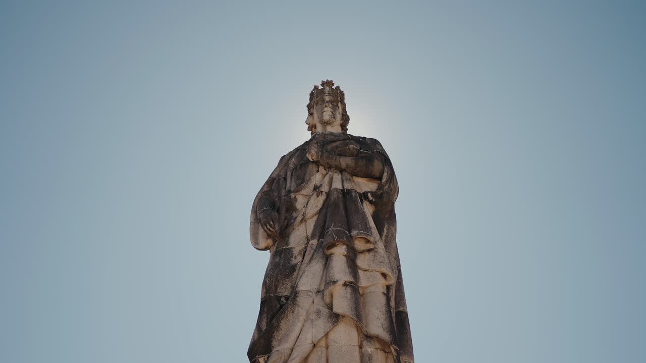 Statue of King D. Dinis at Parque de Santa Cruz, Coimbra, Portugal, against clear sky