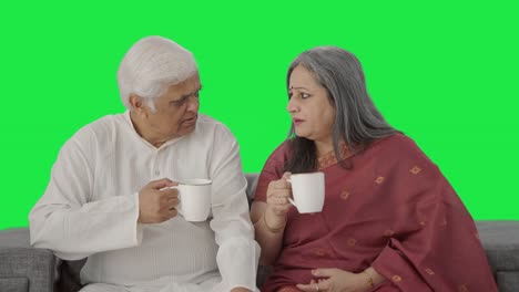 Old-Indian-couple-drinking-tea-and-enjoying-Green-screen