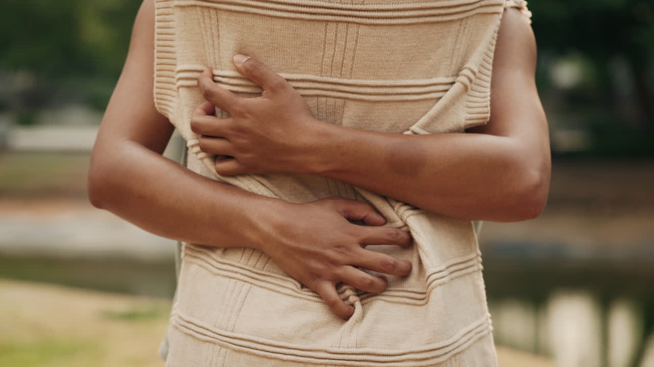 Person experiencing stomach pain