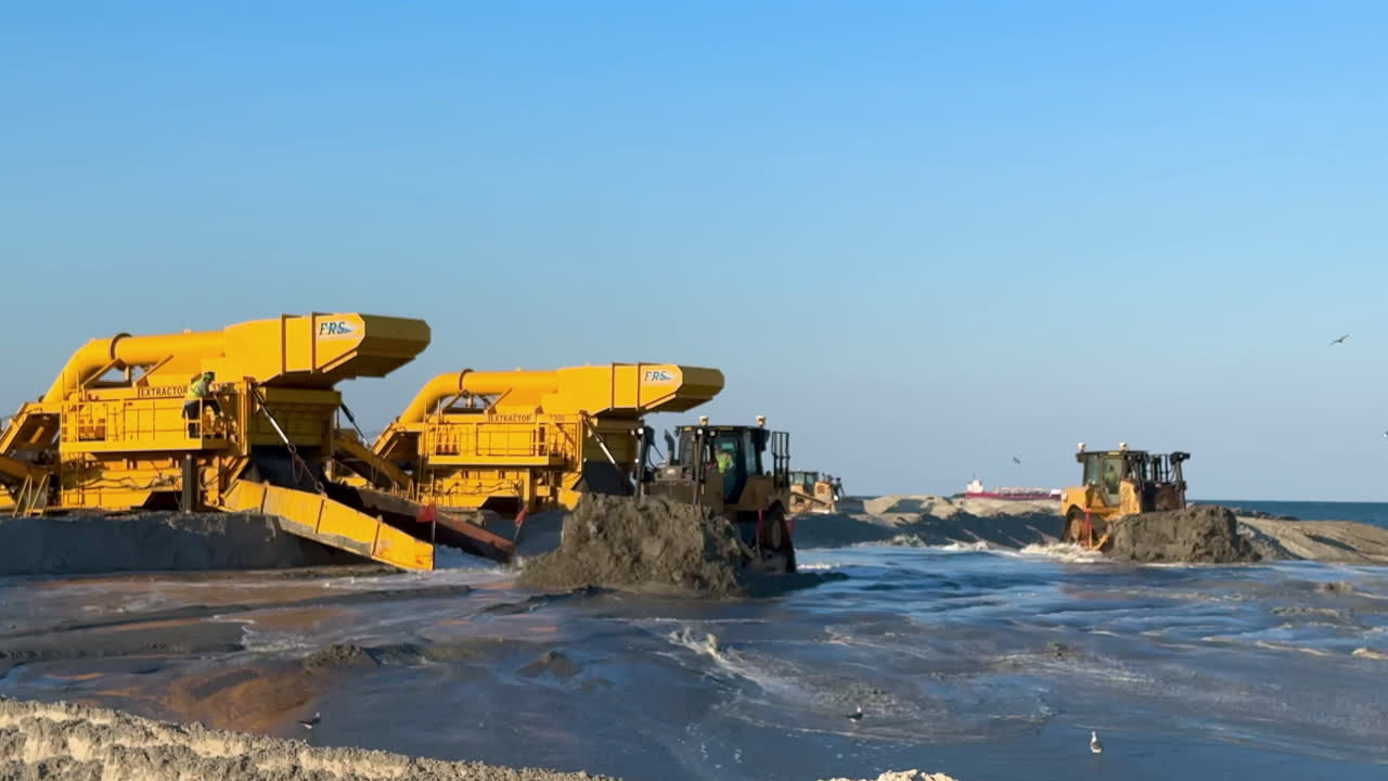 Heavy machinery working on beach renourishment project