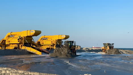 heavy machinery working on beach renourishment project