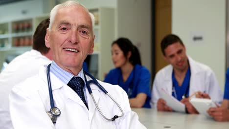 Medical-professor-smiling-at-the-camera-during-class