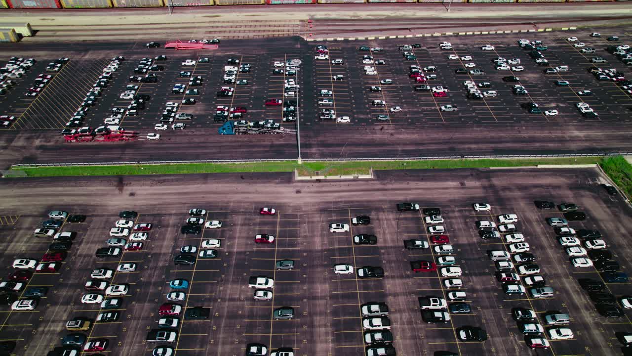 Aerial footage of a huge car transport company parking lot near Chicago.