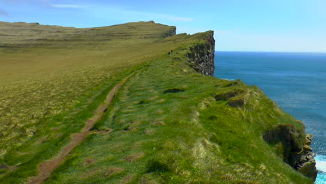 beautiful, green cliffs in latrabjarg promontory over atlantic ocean in the westfjords of iceland - the westernmost point in iceland