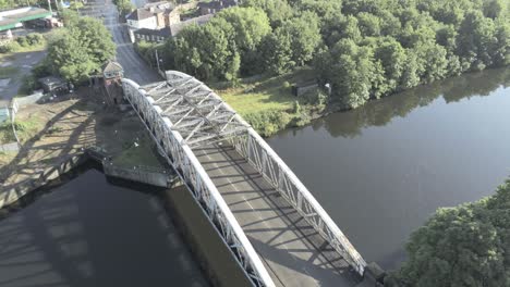 aerial view scenic old vintage steel archway traffic footbridge over manchester ship canal lowering to crossing