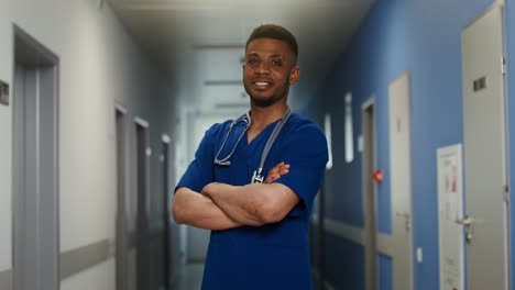 smiling doctor in hospital corridor