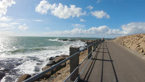 4k shot of the beautiful footpath next to the ocean shore at varberg, sweden