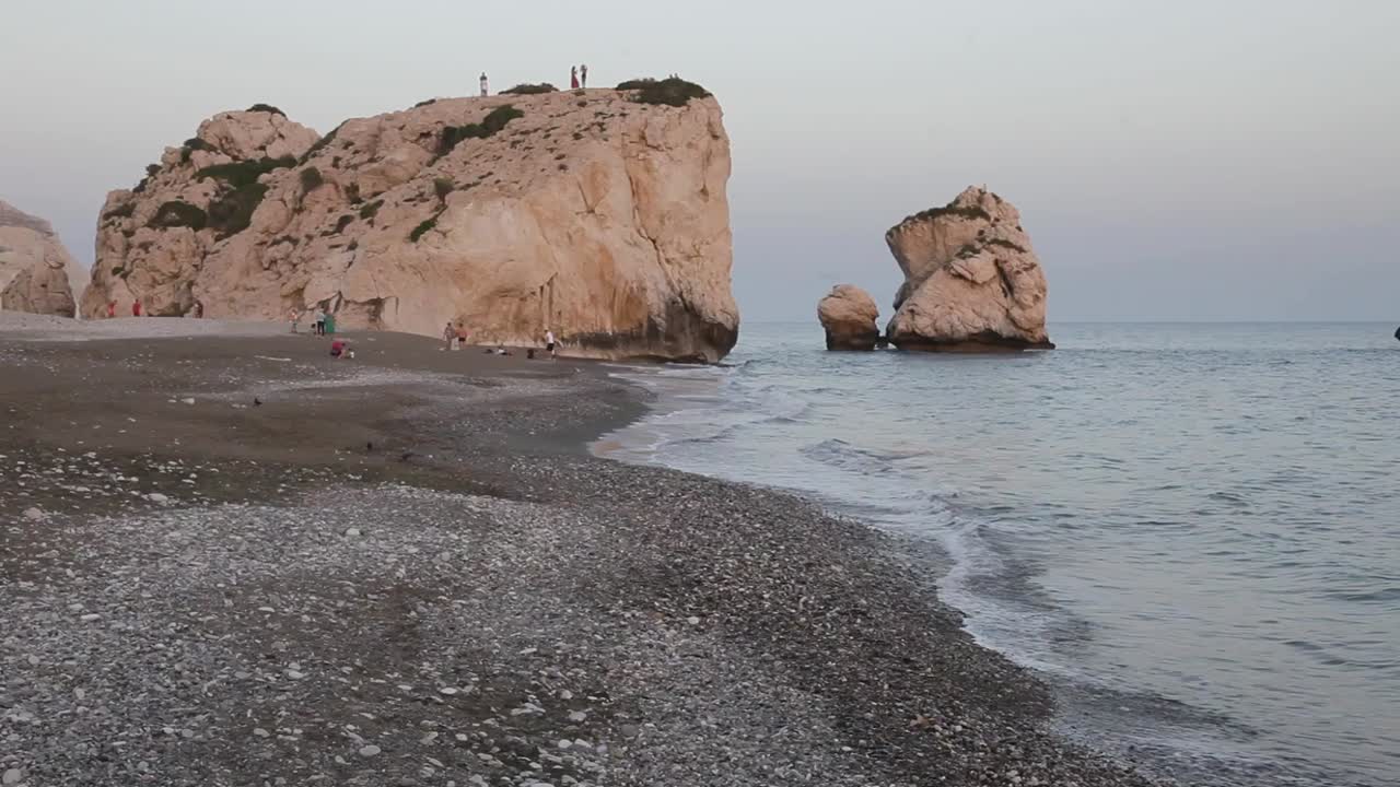 Beautiful Seascape with Rocks and People at Petra tou Romiou Beach in Cyprus