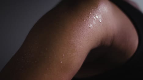 close up shot of beads of sweat on woman wearing gym fitness clothing exercising 3