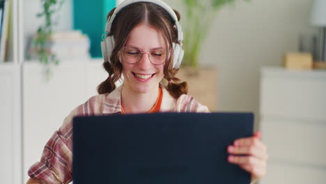 Young-Student-Closes-Her-Laptop-After-Online-Lessons