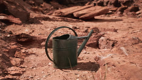 beverage can in sand and rocks desert