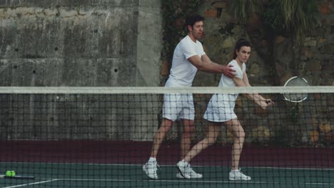 Woman-and-man-playing-tennis-on-a-sunny-day