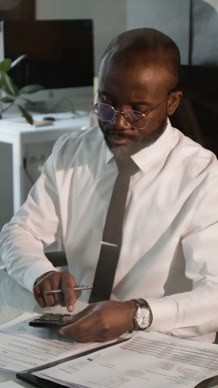 Businessman Working on Financial Documents