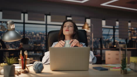 relaxed boss drinking tea late evening workplace closeup. business woman break