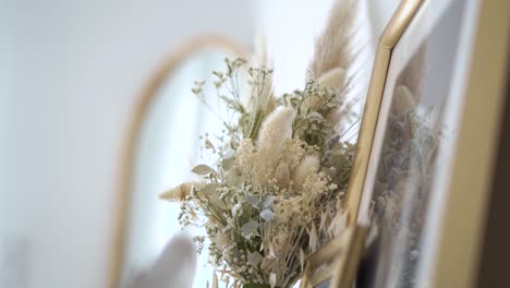 Close-up-shot-of-Countryside-wildflowers-bouquet-near-photo-frame,-Dolly-shot