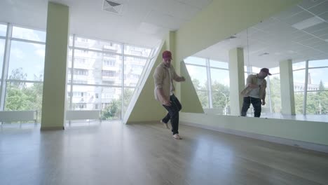 man breakdancing in modern studio