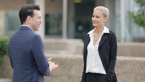 business professionals shaking hands outdoors