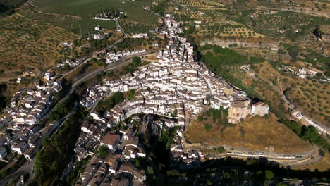 panoramic view over setenil de las bodegas town in spain - aerial drone shot