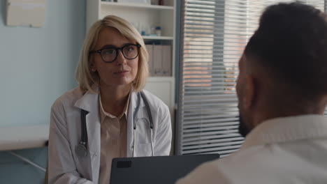 doctor consulting with patient in clinic