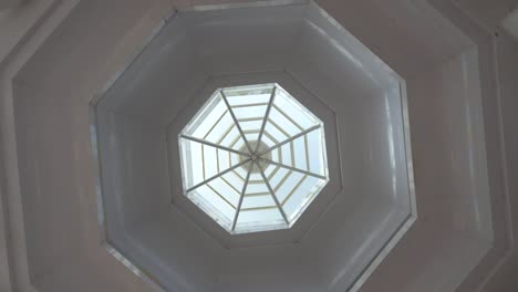 concrete octagonal roof with glass in the center