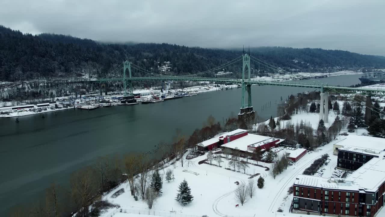 US, Oregon, Portland, St Johns, 2025-02-14 - Drone view of the St Johns Bridge in Portland in the snow