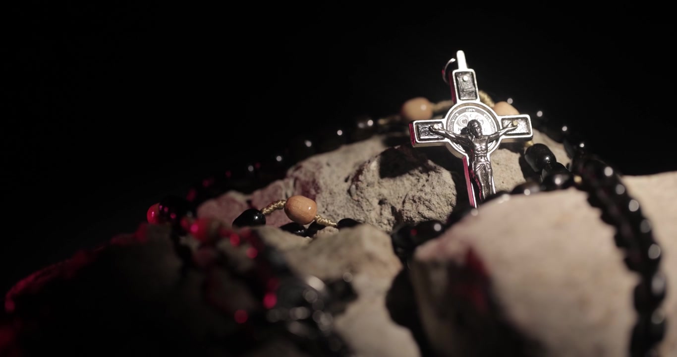 Black Rosary on Stones with Metal Cross Featuring Jesus Figure, Product Shot, 4K