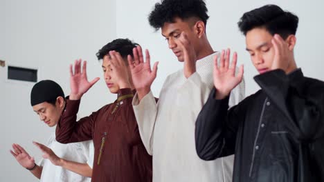 group of young muslim men starting pray salah together in the mosque