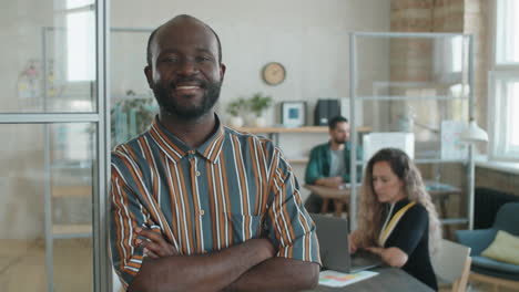 portrait of happy black businessman in office