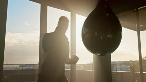 Sport,-man-and-boxing-with-punching-bag-in-gym