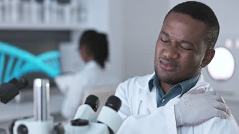 Black-man-scientist,-laboratory-microscope