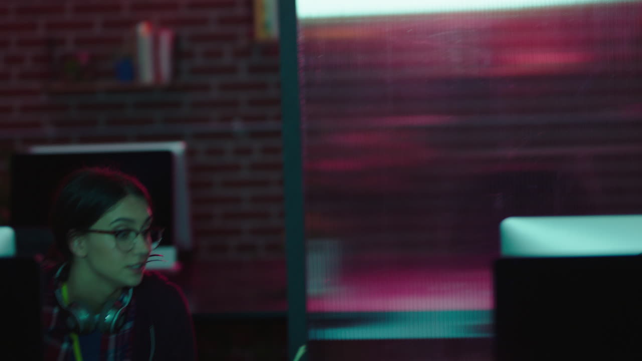 business people working late creative team using computer technology brainstorming colleagues finished work project in office at night