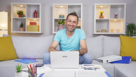 Home-office-worker-man-expressing-his-mind-and-success-to-the-camera.