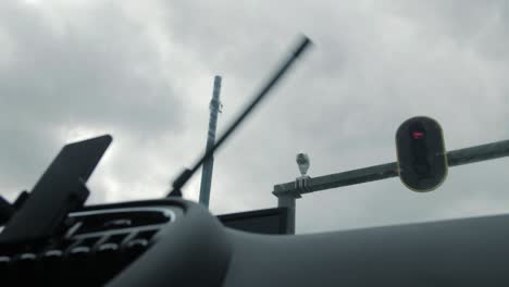 a car's perspective of a traffic surveillance camera monitoring at a red light