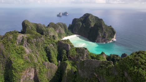 Aerial drone video of Phi Phi Leh with Maya Bay and Pileh Lagoon, Krabi province, Thailand. Aerial top view of amazing tropical island with turquoise water and white beach, famous travel destination.