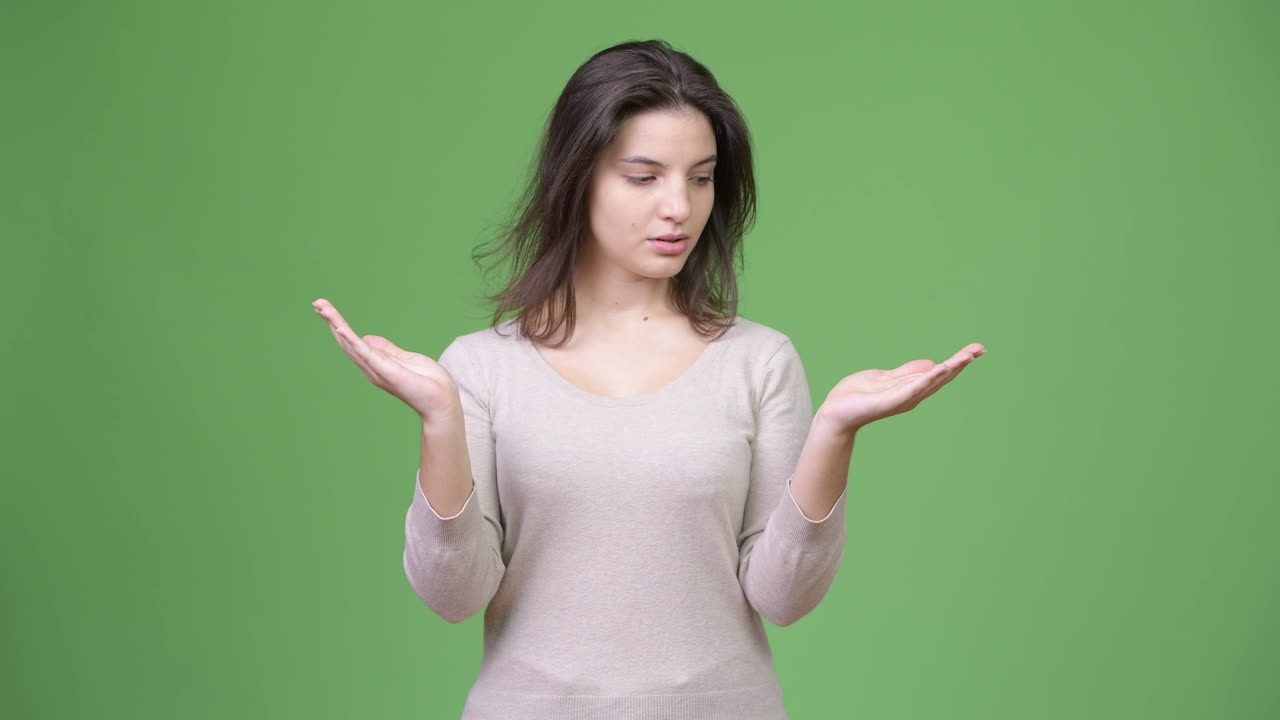 Young beautiful woman choosing between left and right