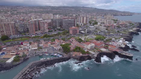 aerial trucking shot of the waterfront of catania, sicily, italy