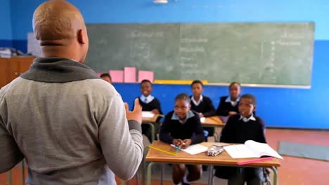 male teacher teaching students in the classroom 4k