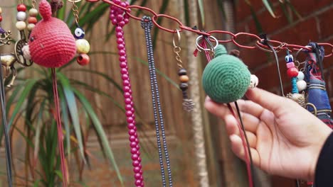 woman looking at handmade jewelry and accessories