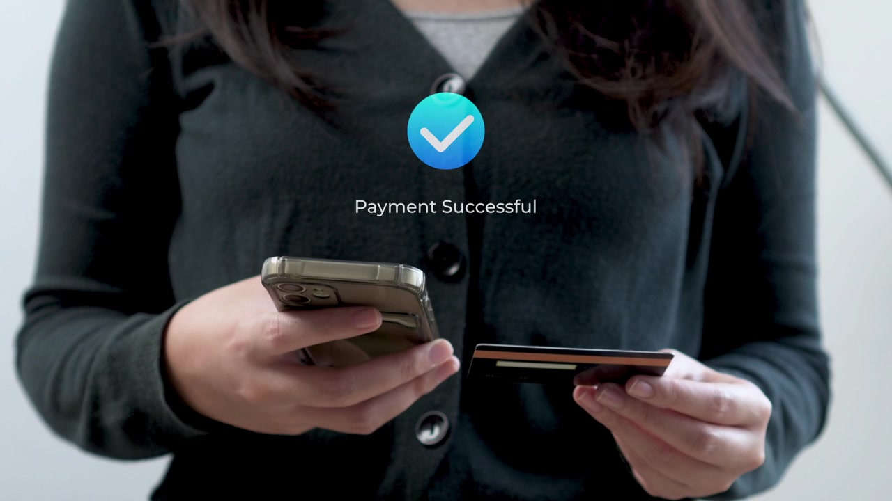 Woman using smart phone and credit card for Direct peer-to-peer bank payment transfer processing