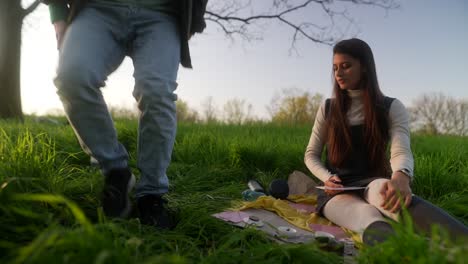 woman meditating in nature with tarot cards