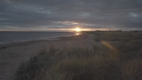 amazing view of wild beach in scotland during sunrise