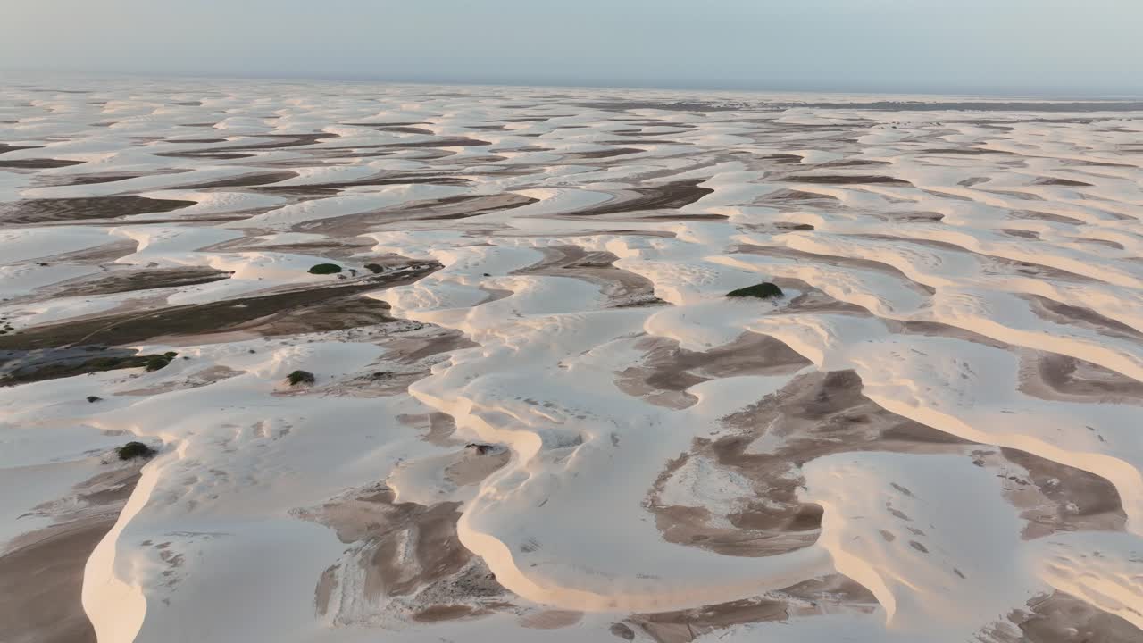 Drone view of the sweeping dunes at Lençóis Maranhenses National Park flooded by the rain.