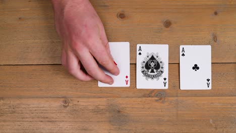 Dealer-plays-Four-a-kind-with-A-on-a-wooden-table,-play-poker