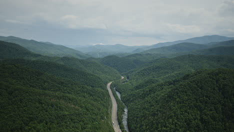 aerial hyperlapse of i-40 weaving through the mountains outside of asheville, north carolina