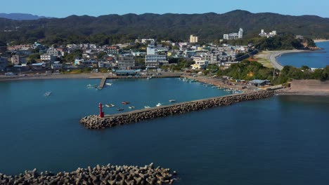 Osatsu-Fishing-Port,-Aerial-Tilt-Reveal-of-Town-in-Mie,-Japan-4k