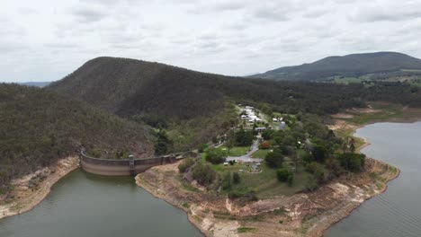 Aerial-Footage-of-a-Dam-surrounded-by-mountains